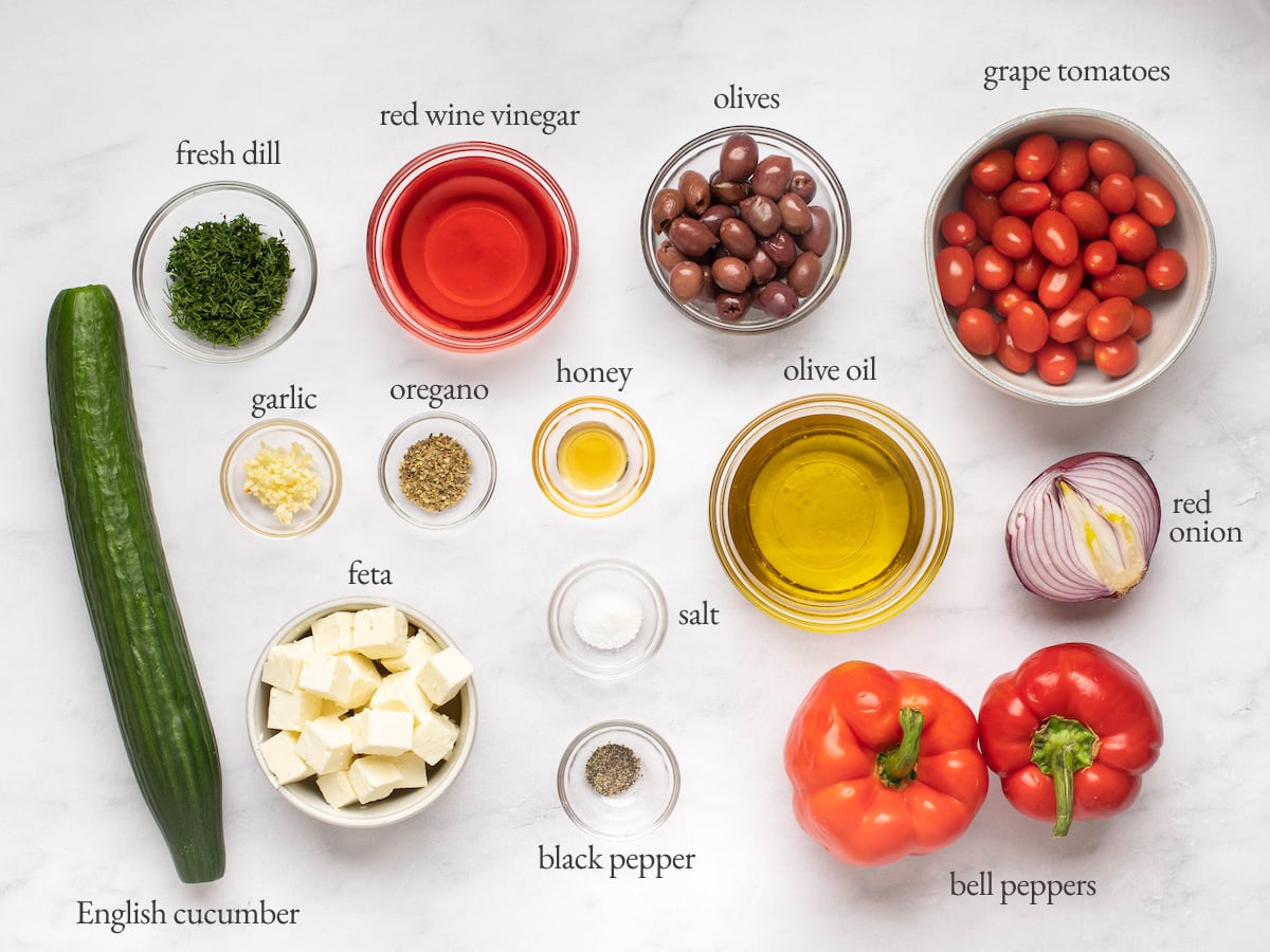 Ingredients to make the best Greek salad no lettuce on the table in bowls.