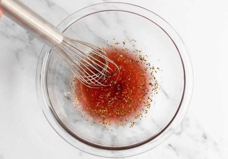 whisking the vinaigrette