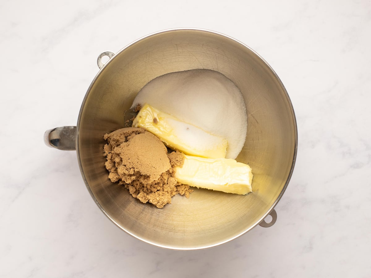 butter and both sugars in bowl of electric mixer fitted with paddle attachment