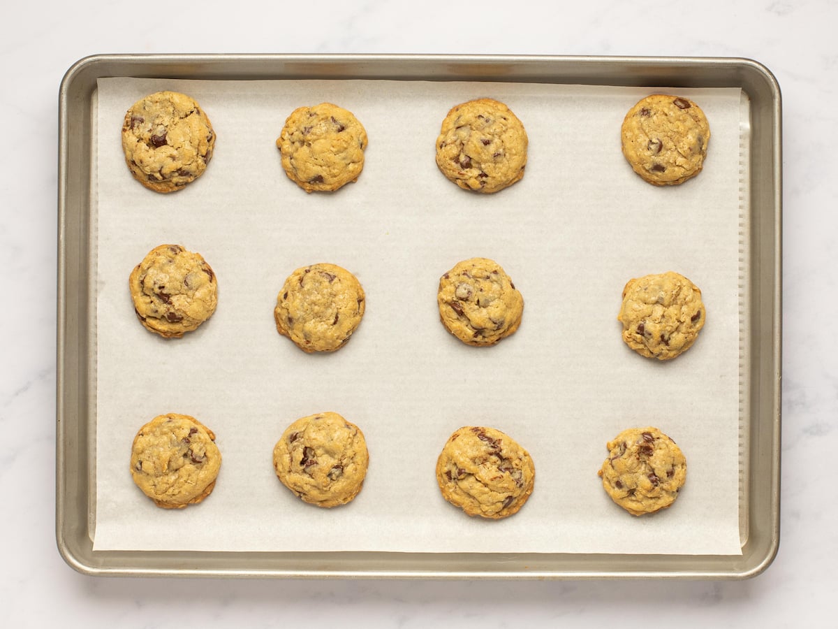 baked chocolate chip oatmeal cookies on baking sheet