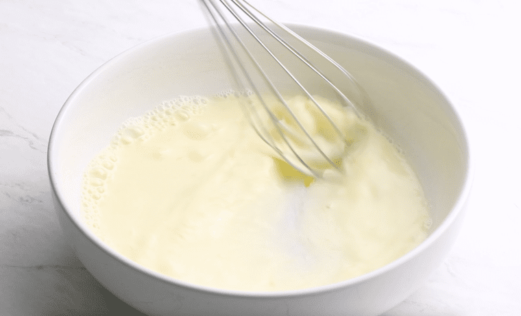 whisking wet ingredients for breading the chicken