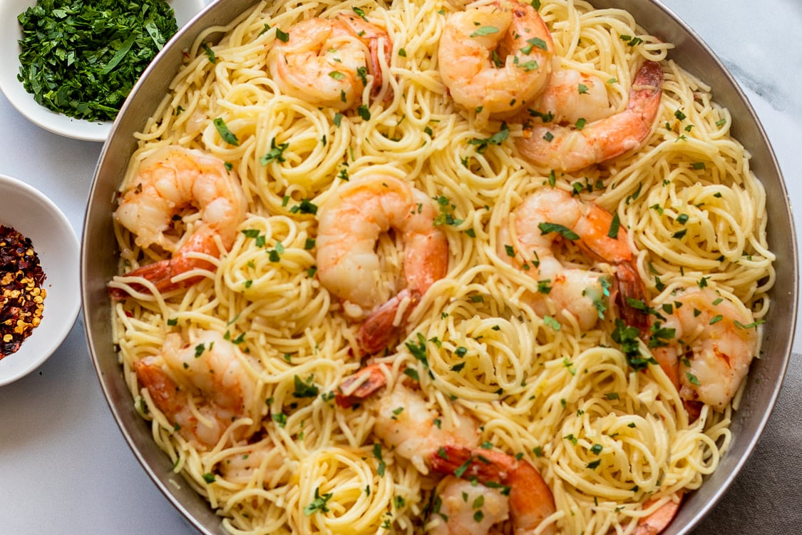 shrimp scampi with pasta in skillet