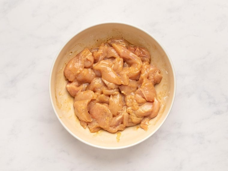 chicken coated with sauce, cornstarch, and salt