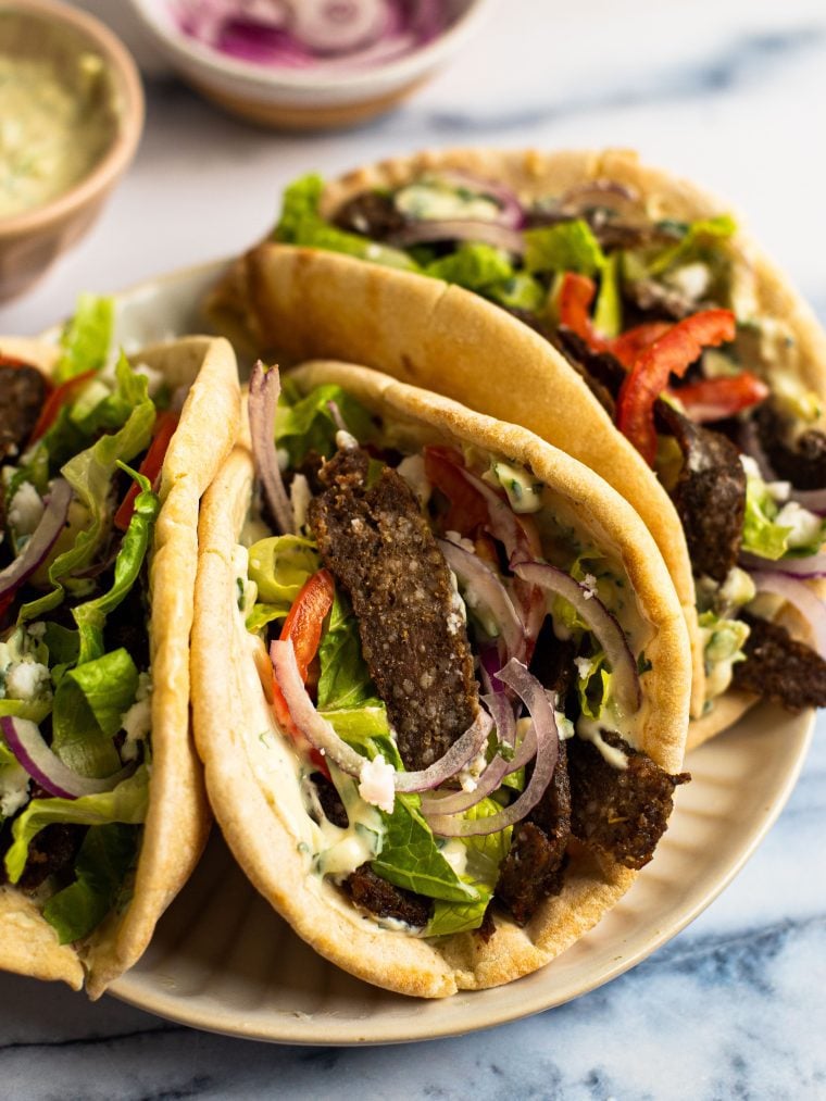 Three gyros on a plate.