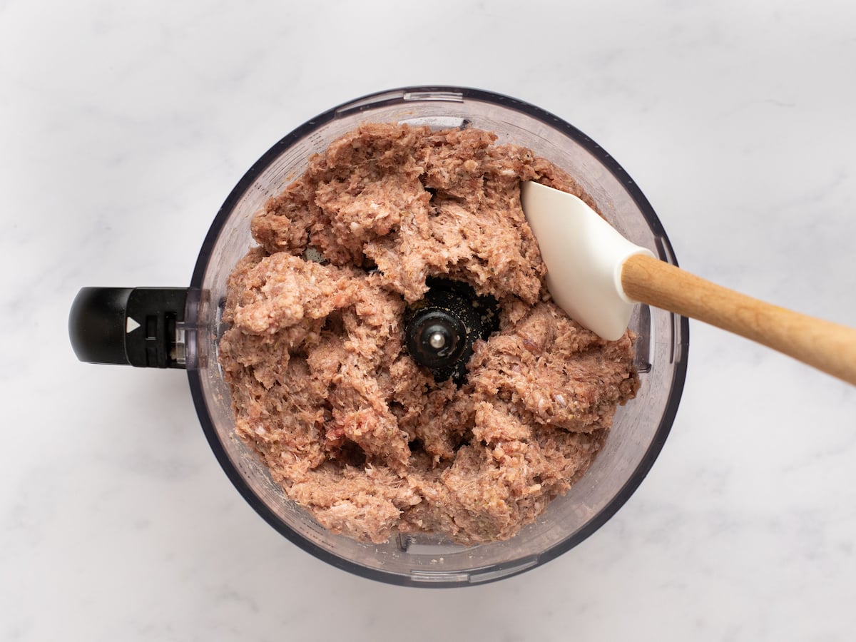 Pureed meat for gyros in the food processor bowl.