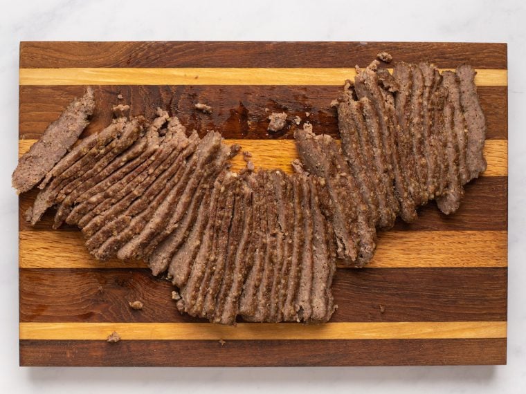 loaves thinly sliced on cutting board