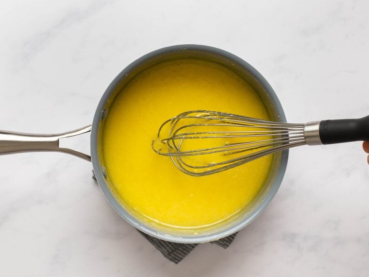 whisking the sugar, eggs, lemon zest, lemon juice, and salt until mixture is thickened