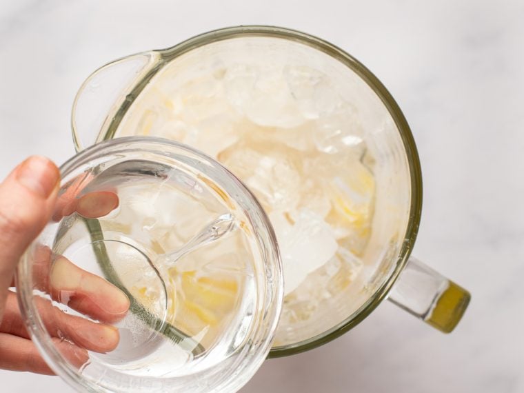 adding rum to the blender