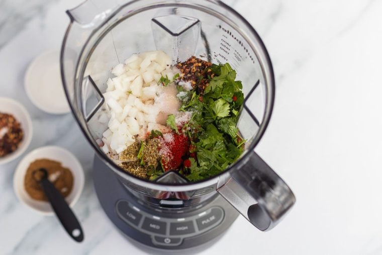 tomatoes, onions, cilantro, garlic, wine vinegar, oil and seasoning in blender