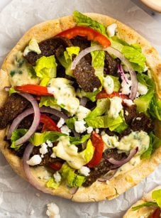 Gyros assembled on a piece of parchment paper.