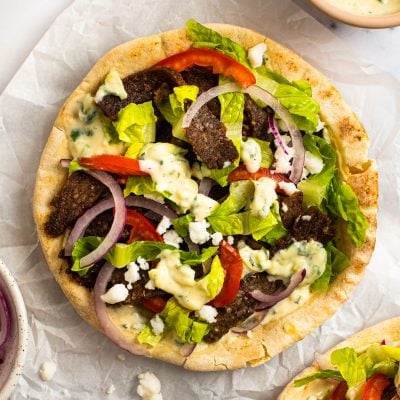Gyros assembled on a piece of parchment paper.