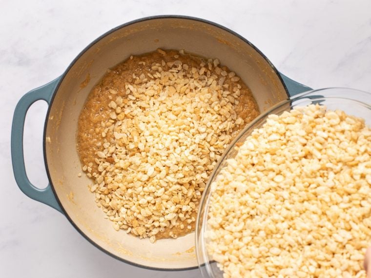 adding cereal to dutch oven