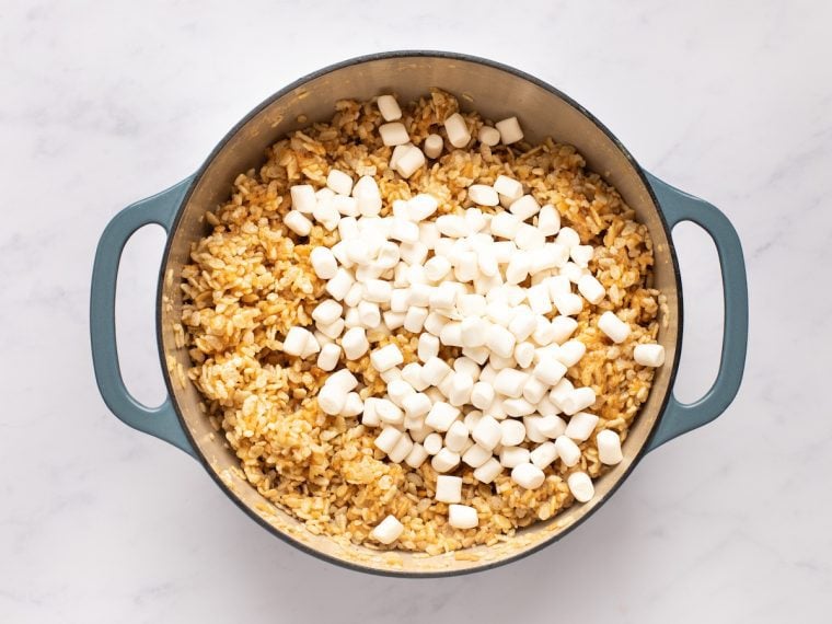 adding reserved marshmallows to dutch oven