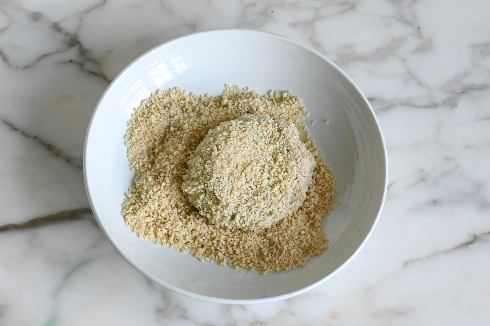 Breading the patties with panko.