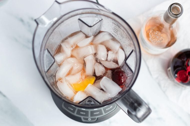 peaches, cherries, rosé, and 2 cups of ice in blender
