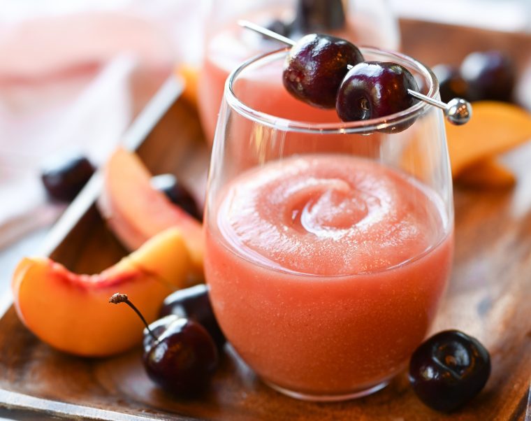 Frose in a glass with cherries.