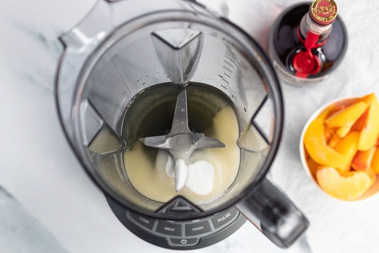 vodka, orange liqueur, lemon juice, and sugar in blender