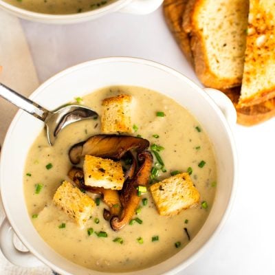bowls of mushroom soup with bread