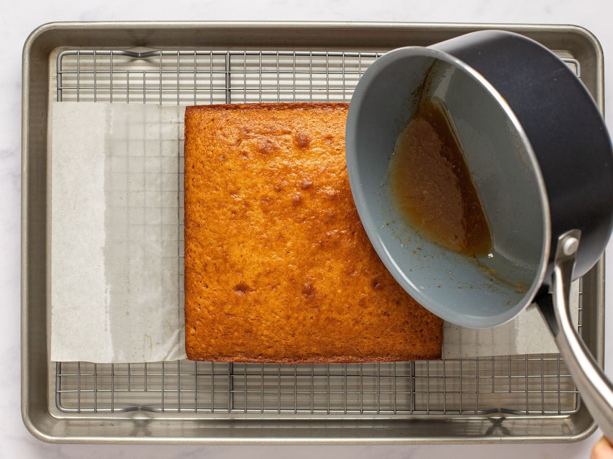 drizzling the cake with the glaze