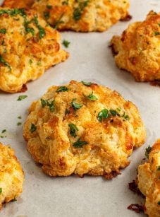 cheddar bay biscuits on baking sheet