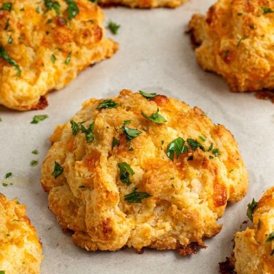 cheddar bay biscuits on baking sheet