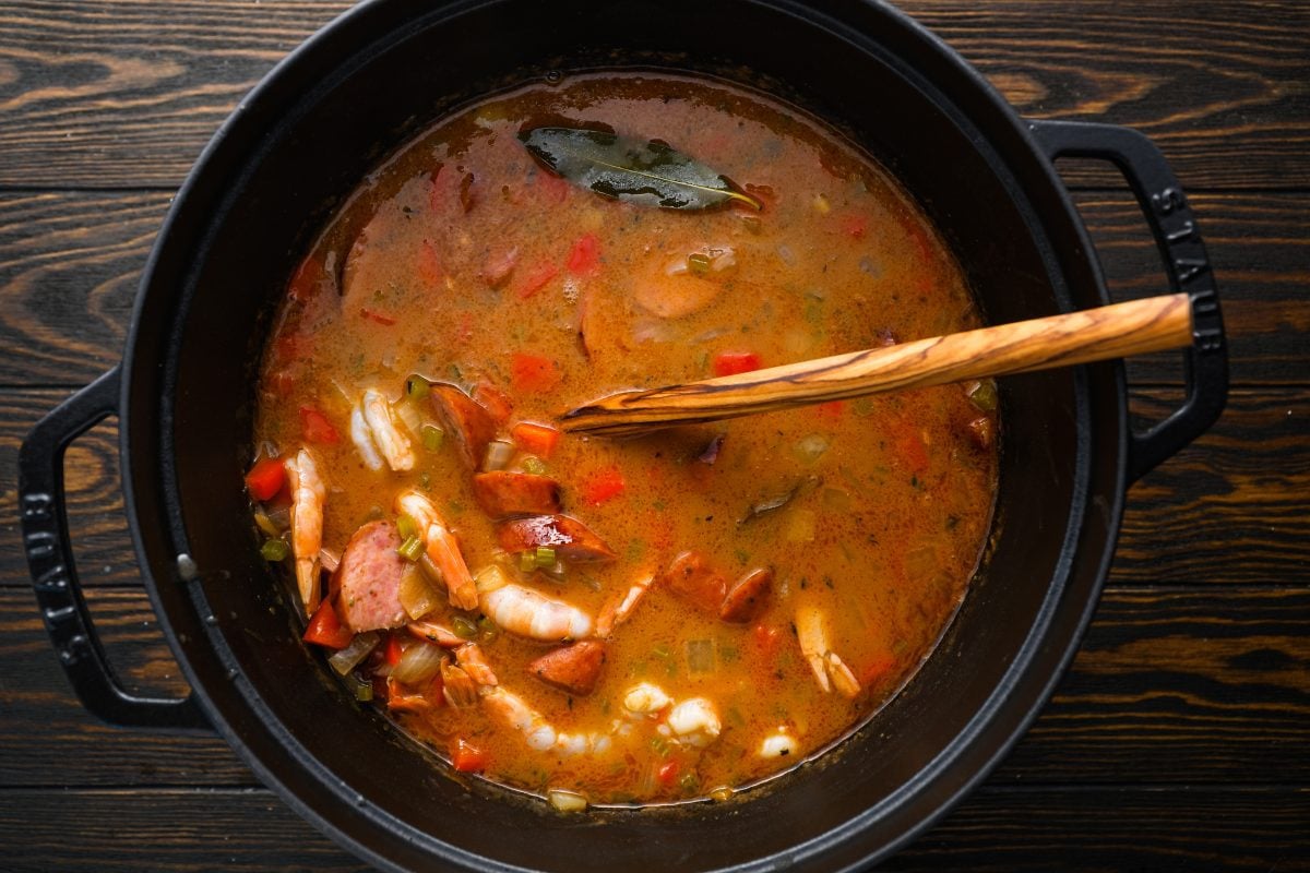 sliced sausage and shrimp added to dutch oven
