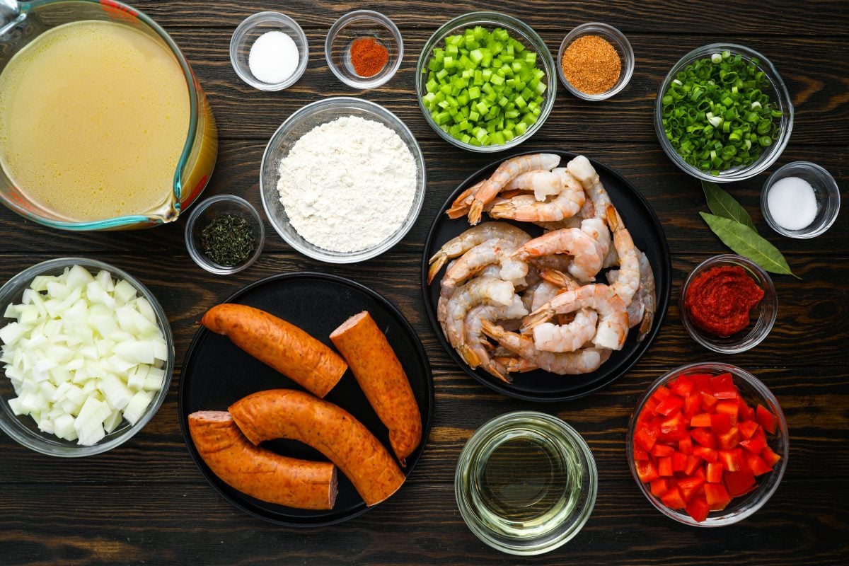 Gumbo Ingredients including sausage, shrimp, and onion.