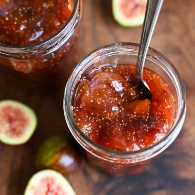 Spoon in a jar of fig jam.