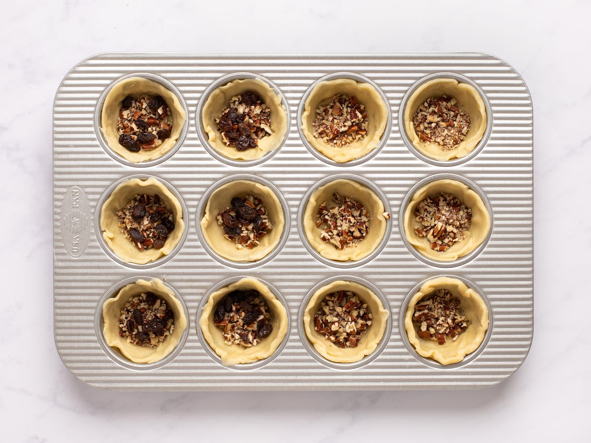 raisins and pecans inside dough cups