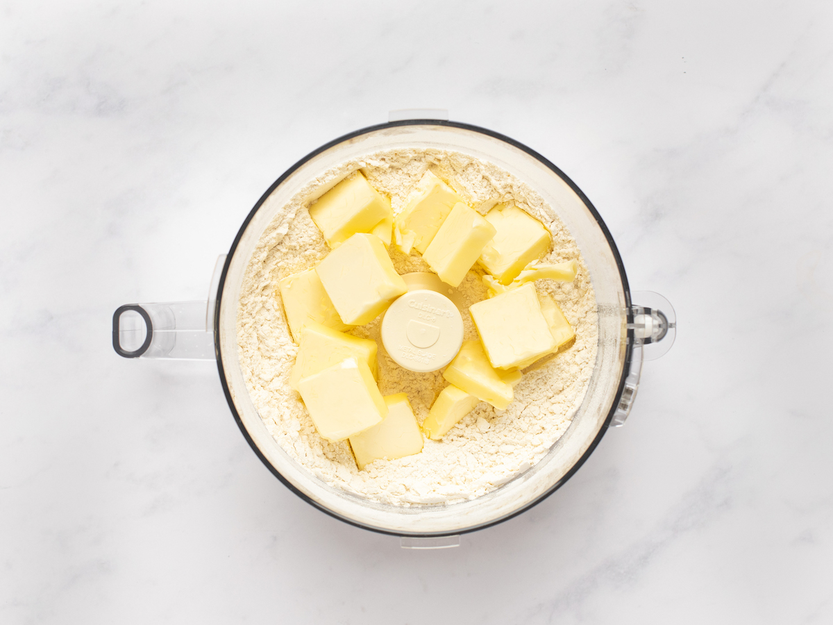 cold butter in food processor with flour, salt, and sugar