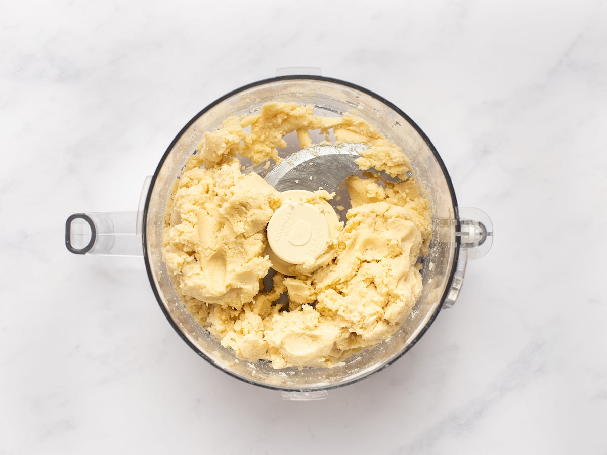 water mixed into flour/butter mix to make clumpy dough