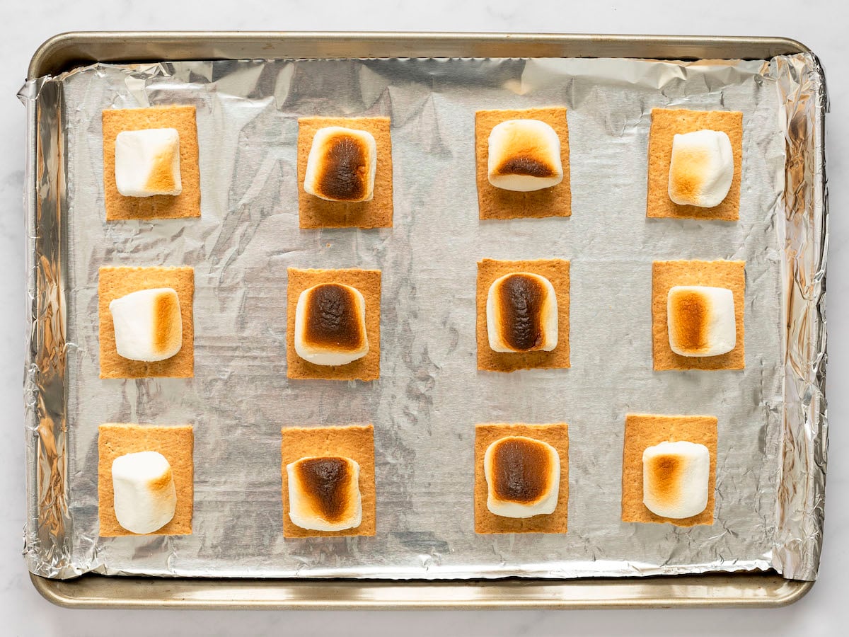 charred marshmallows on baking sheet
