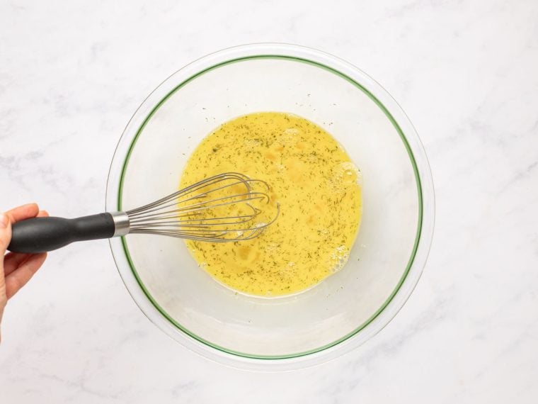 whisking eggs, salt, and dill into milk/cornstarch mixture