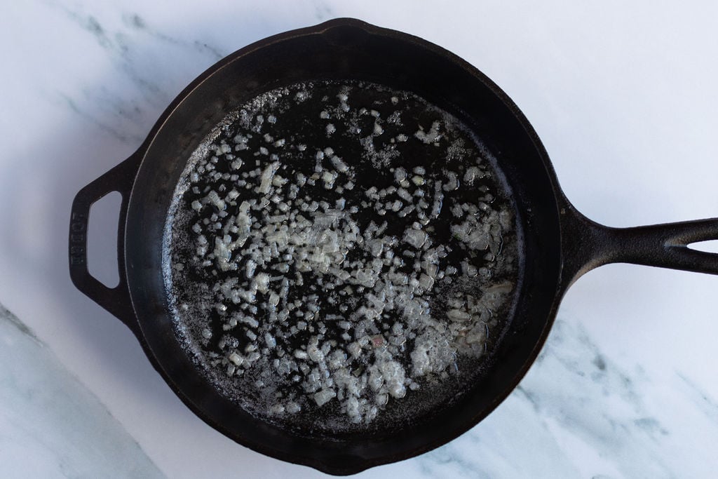 skillet with shallots cooking in butter