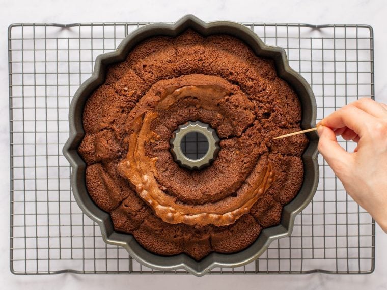 poking holes in cake with toothpick