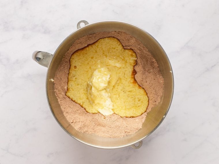 butter and part of buttermilk mixture in mixing bowl with dry ingredients
