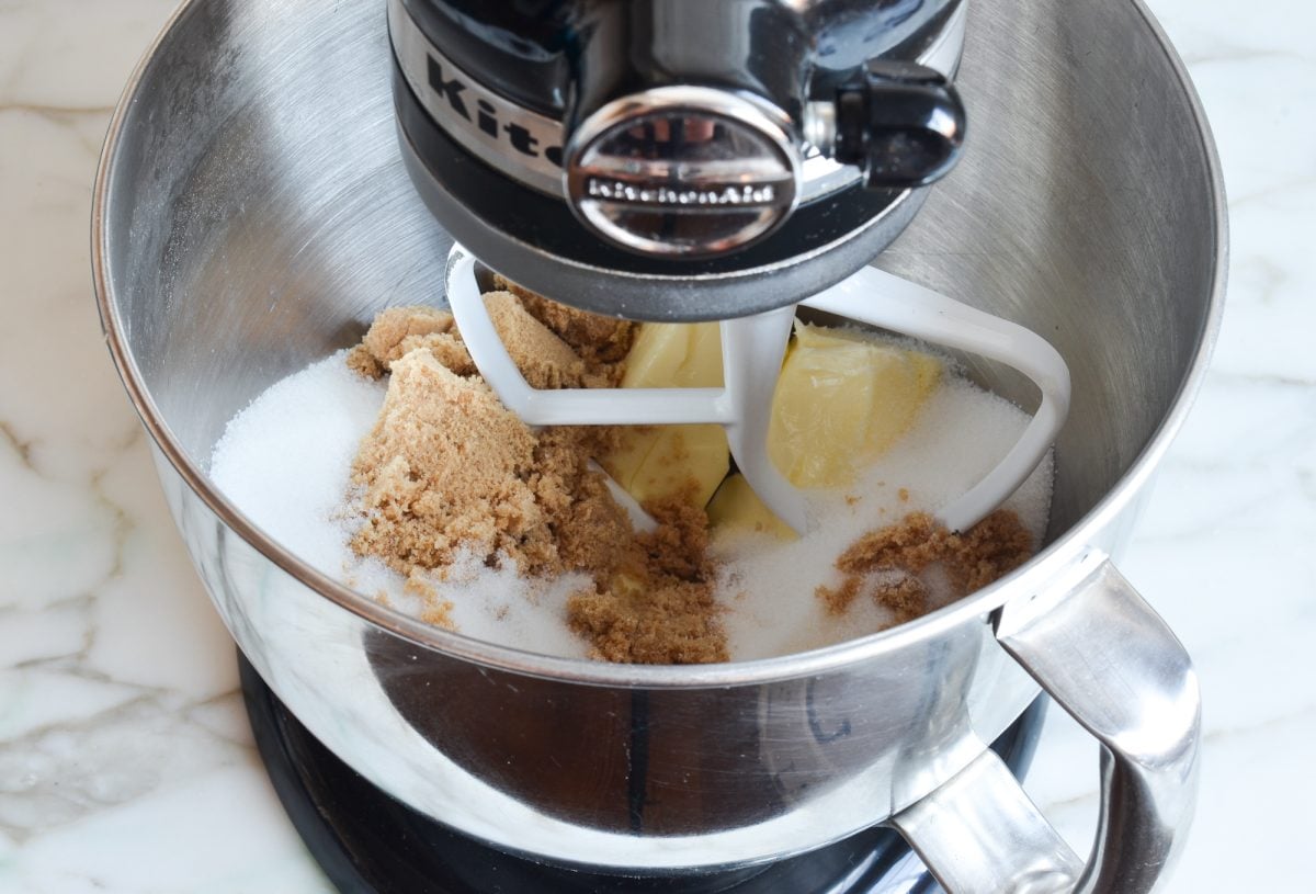 Butter and sugars in the bowl of a stand mixer.