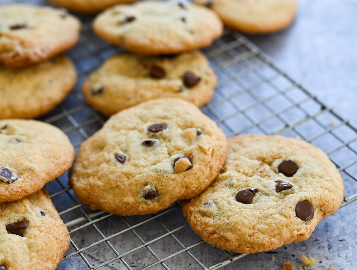 Gluten free chocolate chip cookies cooling on a wire rack.