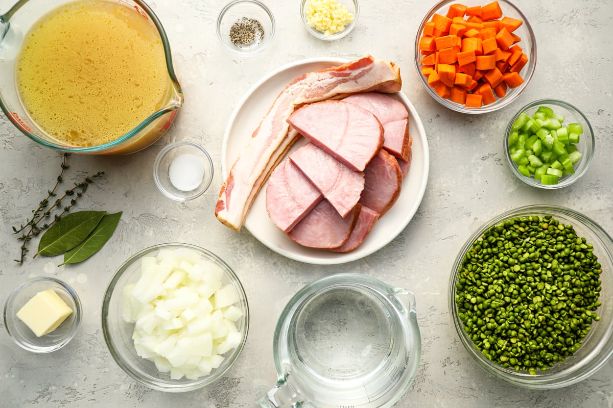 ingredients to make split pea soup on white marble board
