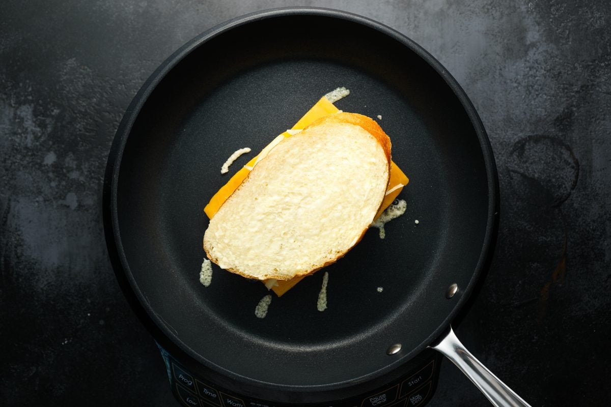 assembled sandwich put into skillet