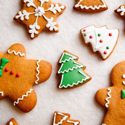 decorated gingerbread cookies on parchment paper.