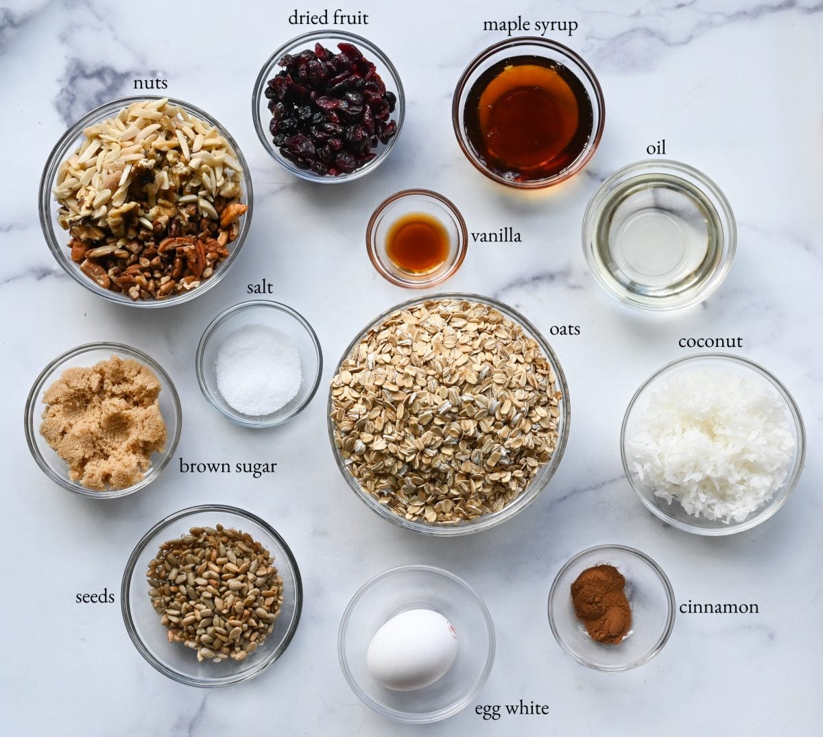 Granola ingredients including coconut, seeds, and brown sugar.