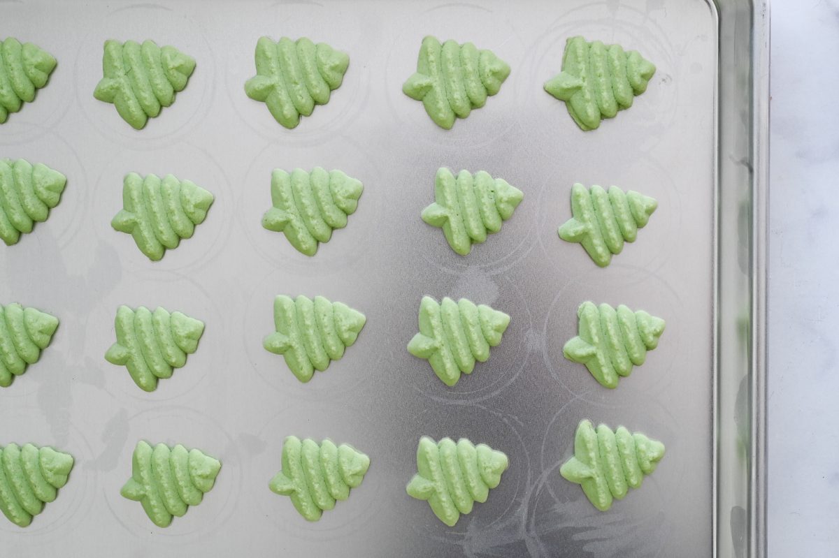 spritz cookies christmas trees on baking sheet 