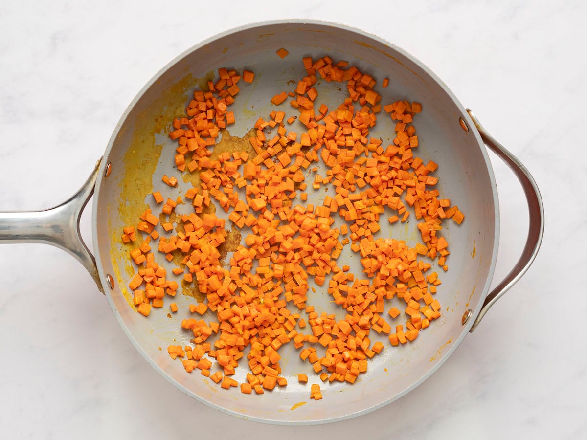 cooked carrots in skillet.