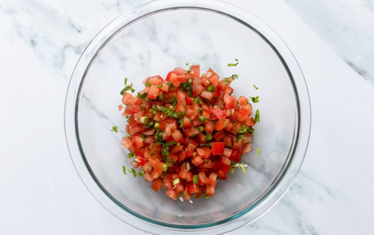 jalapeño pepper, scallions, garlic, cilantro, salt, lime juice, and tomatoes combined