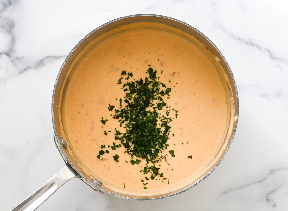 adding cilantro to queso 
