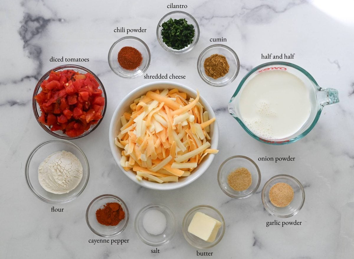 Ingredients including diced tomatoes, half and half, and shredded cheese.