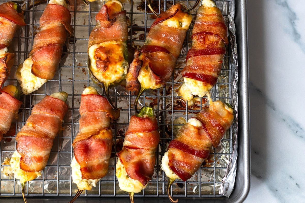 jalapeno poppers on wire rack after being baked and broiled
