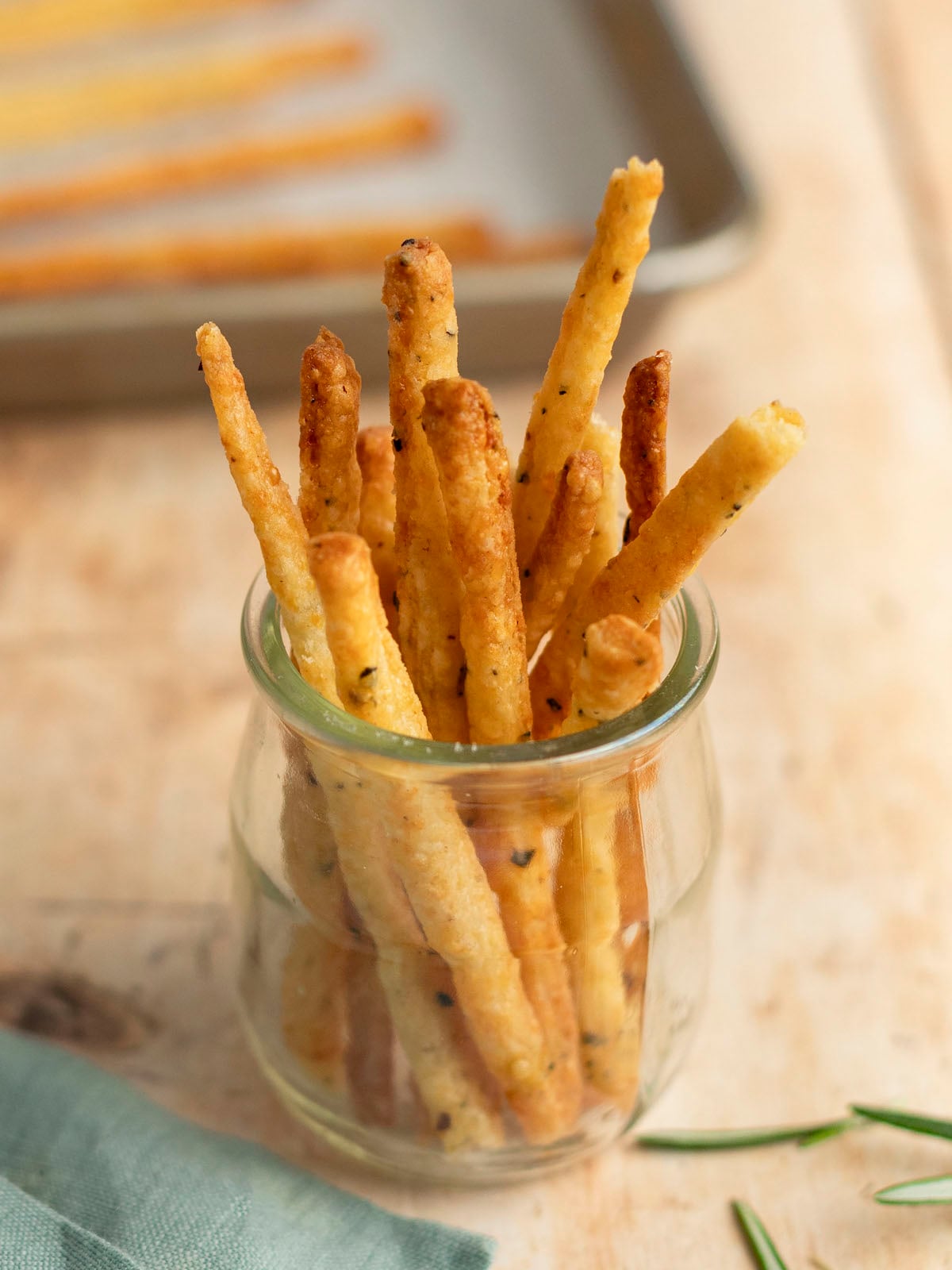 cheese straws in pretty glass jar.
