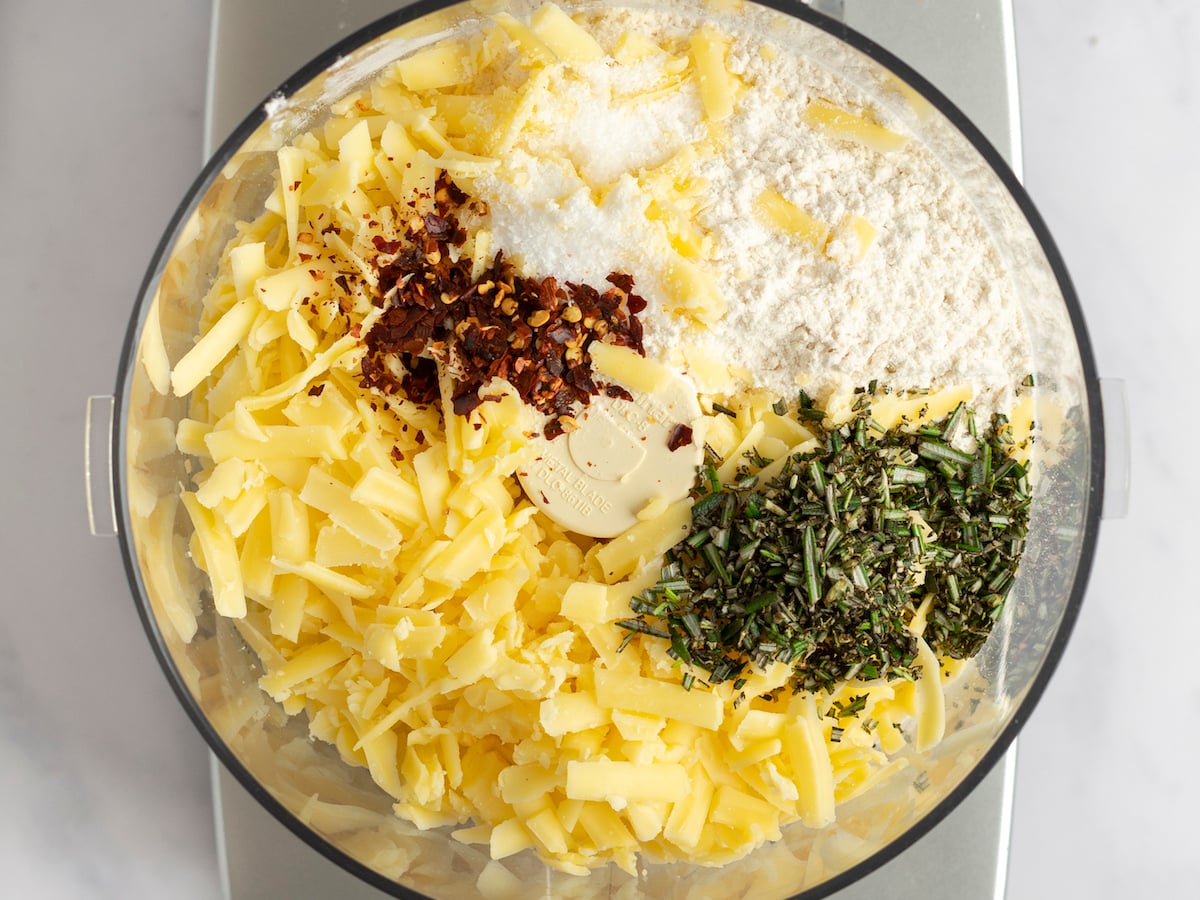 dry ingredients, herbs, pepper flakes, and cheese in food processor.